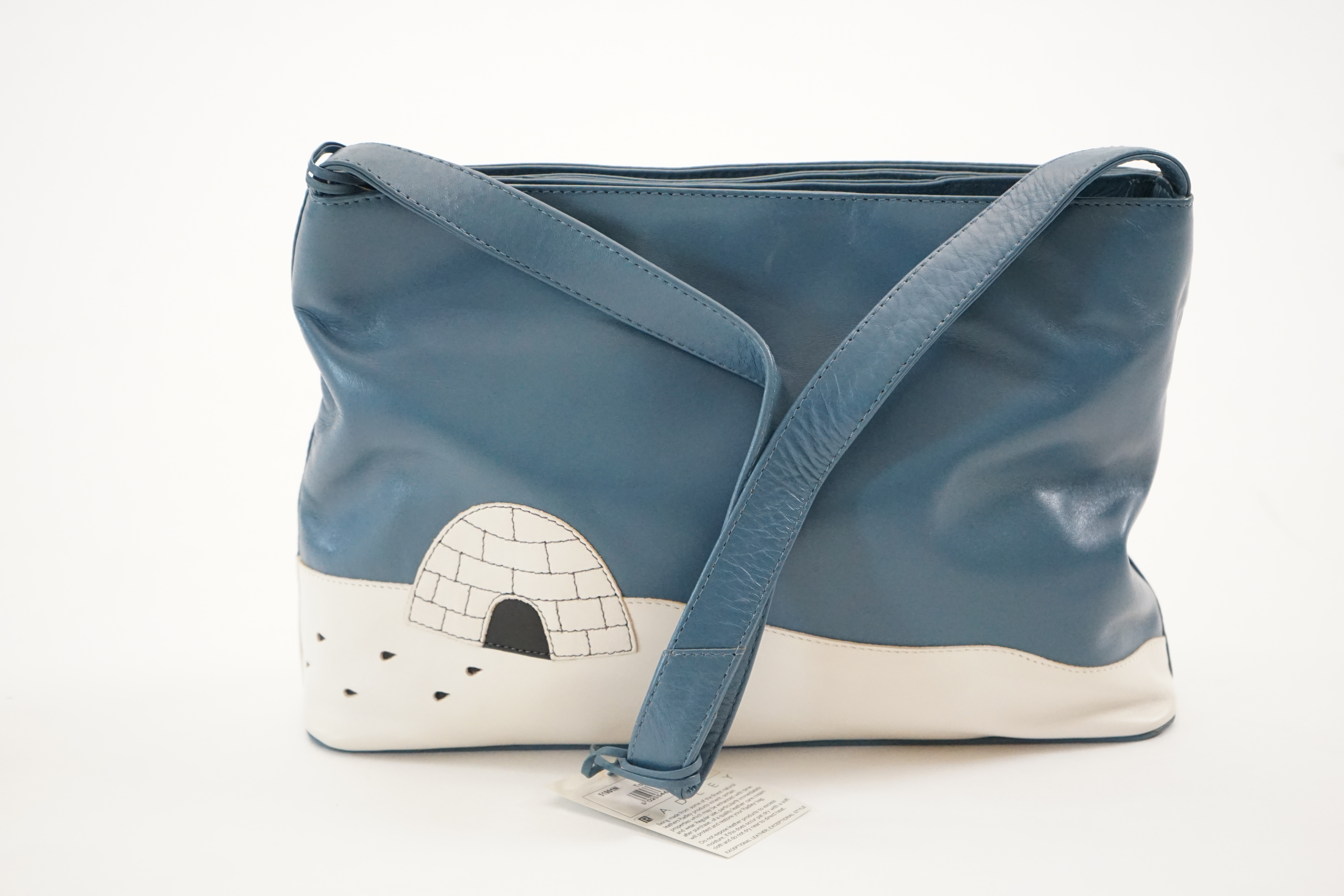 A blue Radley 'Penguins' grab bag 2002, width 29.5cm, depth 8cm, height 19.5cm